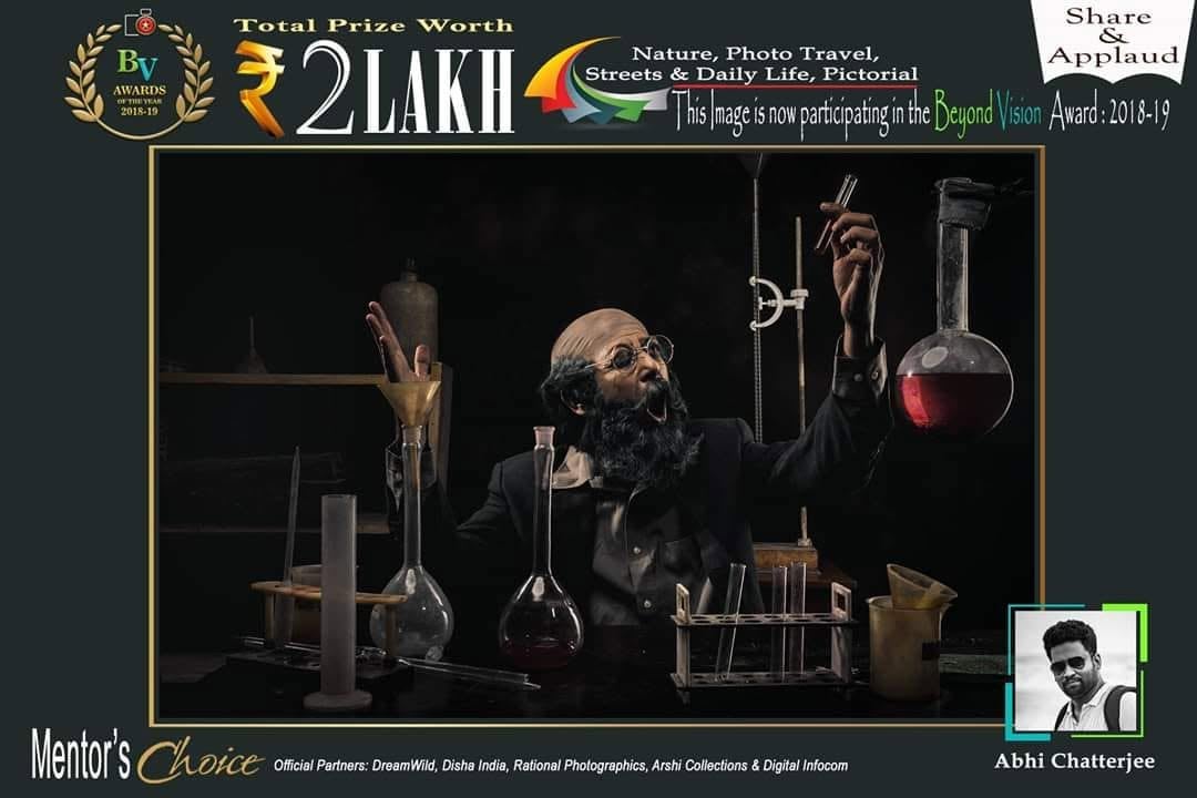 A Beyond Vision poster marked Mentor's Choice, showing a figure at a table of glass flasks.