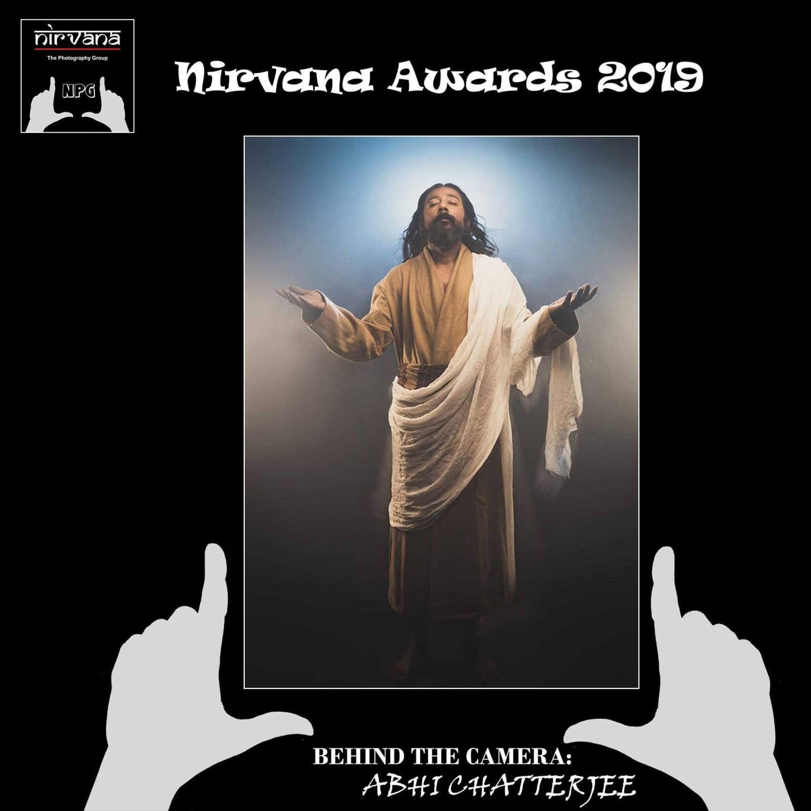A Nirvana Awards 2019 card holding up a framed picture of a figure with open arms.
