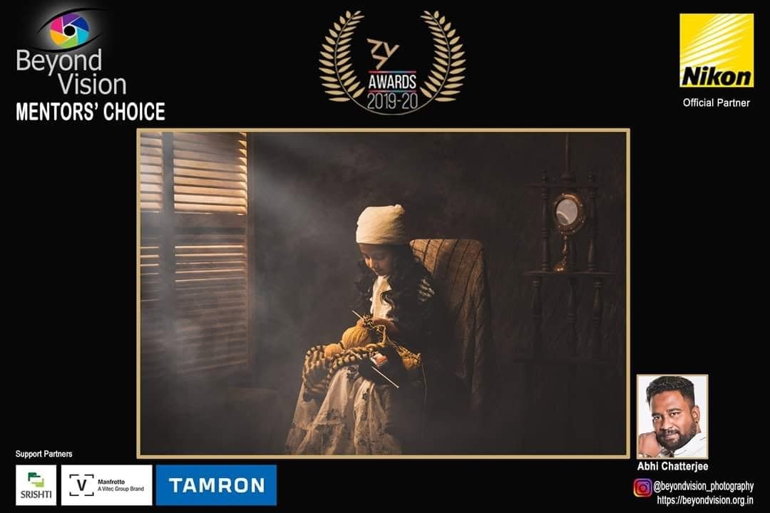 A Beyond Vision ZY Awards poster marked Mentors' Choice, showing a child keeping watch over toys by a window.