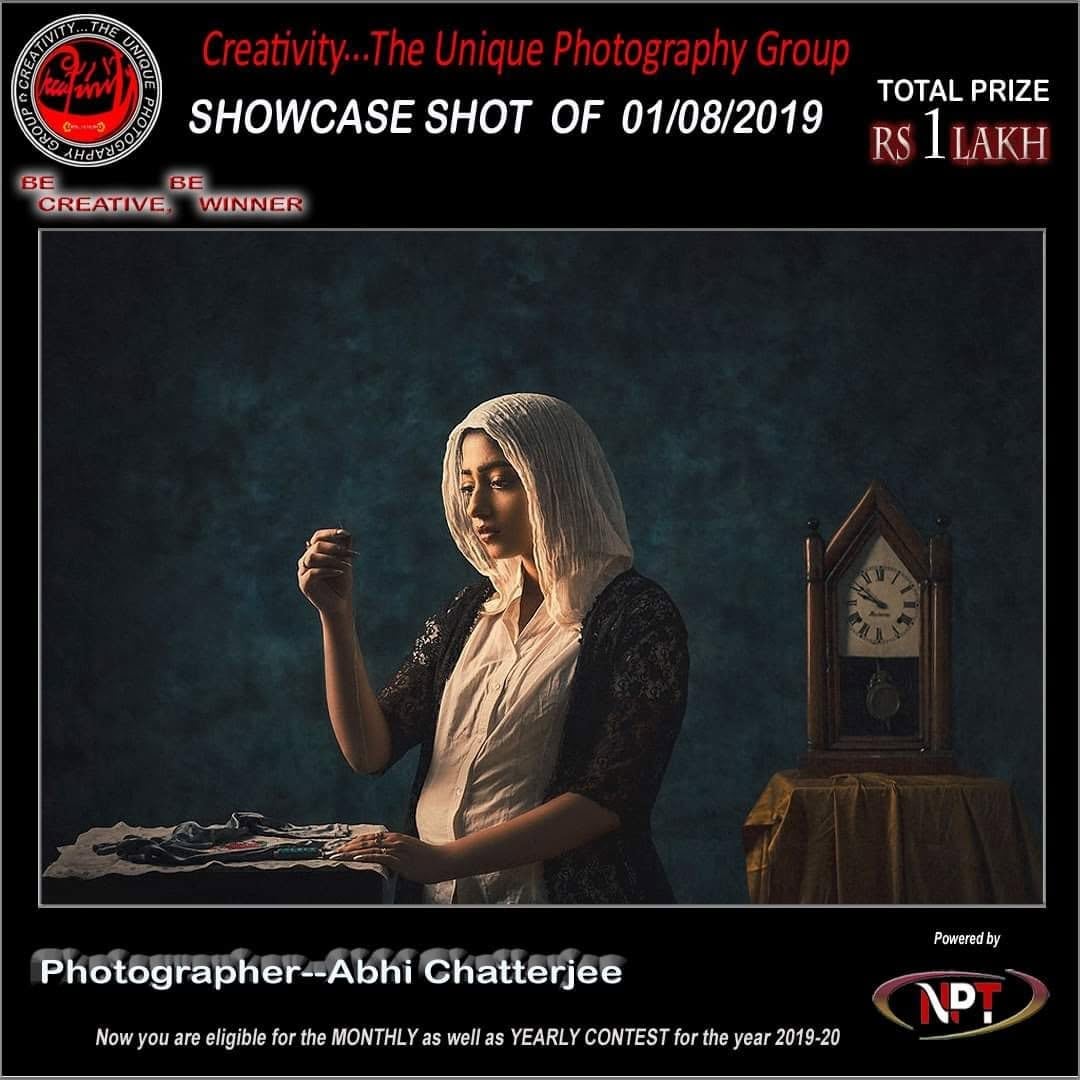 A Creativity showcase card for 1 August 2019, showing a mother and child by a clock.