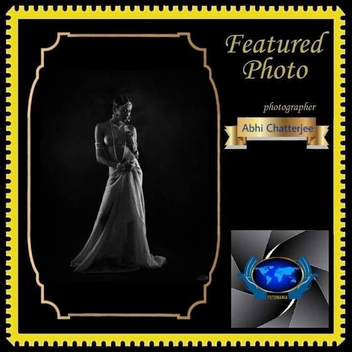 A FOTOMANIA featured photo card showing a woman in a white gown.